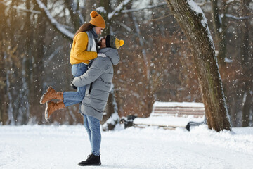 Sticker - Beautiful happy couple outdoors on winter day. Space for text