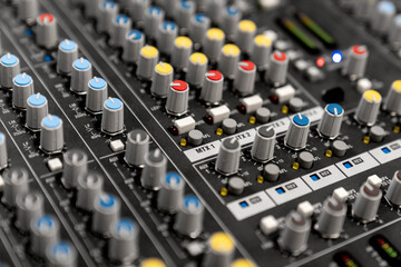 Wall Mural - Mixer control. Music engineer. Backstage controls on an audio mixer, Sound mixer. Professional audio mixing console with lights, buttons, faders and sliders. sound check for concert. 