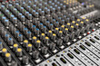 © ATRPhoto - Mixer control. Music engineer. Backstage controls on an audio mixer, Sound mixer. Professional audio mixing console with lights, buttons, faders and sliders. sound check for concert.