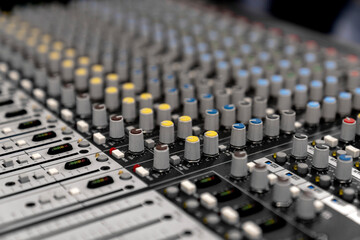 Wall Mural - Mixer control. Music engineer. Backstage controls on an audio mixer, Sound mixer. Professional audio mixing console with lights, buttons, faders and sliders. sound check for concert. 