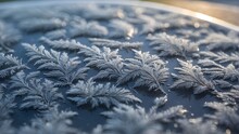 An Intricate Pattern Of Frost On A Window Pane On A Chilly Winter Morning