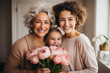 © Michael - grandmother with granddaughters and a bouquet of tulips in the interior of the apartment, looking at the camera and laughing