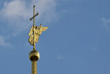 Fototapeta Pomosty - A close-up view of the golden spire of the Peter and Paul Cathedral in the city of St. Petersburg.