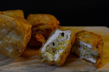 Canvas Print - Tofu filled with vegetables, fried food that is often found on the side of the road. Tofu filled with vegetables is eaten with chili.