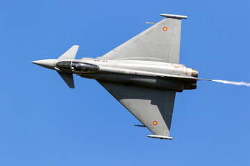 Wall Mural - European fighter jet aircraft in flight on a blue sky