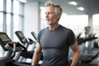 © Sarinrata - Mature man walking on a treadmill at the gym