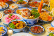 © CravenA - Tet tray. Full of traditional dishes. Chinese new year festival table with asian food. Vietnamese food for Tet holiday in lunar new year. Text on food meaning happy and peaceful.