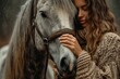 Woman hugging gray horse on cold winter day