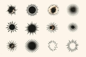 Sticker - A collection of black and white sunbursts on a white background. Perfect for adding a retro touch to designs