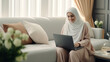 © PaulShlykov - Modern Office: Portrait of Young Muslim Businesswoman Wearing Hijab Works on Laptop, Does Data Analysis, Website Design, Creative Development. Digital Entrepreneur Works on e-Commerce Startup Project