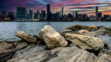Fototapeta Miasta - The New York skyline as seen from the rock cliff pier and overlook of Long Island is a large island that extends from the east of the Big Apple (USA).