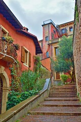 Wall Mural - alley in the historic center of Verona which leads from the Pietra bridge to Castel San Pietro in Veneto, Italy	