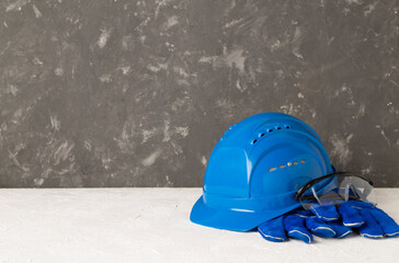 Blue construction equipment on concrete background