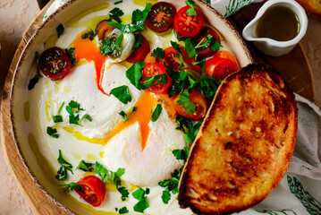 Canvas Print - Turkish eggs. cilbir.traditional breakfast dish. selective focus. hugge style