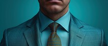  A Close Up Of A Person Wearing A Suit With A Blue Shirt And A Green Tie With A Yellow Polka Dot Tie And A Blue Background With A Man's Face.