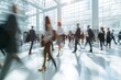 © SKIMP Art - Large busy lobby with many people in blurry focus Generative AI