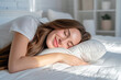 beautiful young smiling woman sleeping in bed