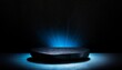 black stone platform podium with blue color light on black background for product display presentation and advertising copy space