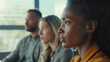 © Ed - Close-up portrait of a young African American businesswoman at a meeting in the office, discussion before making decisions in an international company