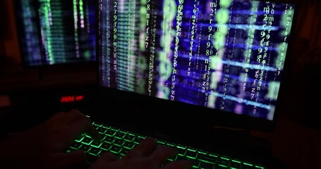 Wall Mural - close up of hands typing code on a laptop keyboard with multiple screens of codes and program softwa