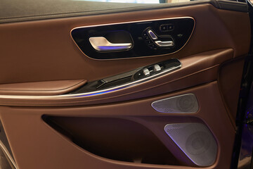 Sticker - Buttons to lock and unlock the locks on the driver's door of a new modern premium car