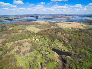 Poster - Ruins of a manor house belonging to the von Sanden family in Nowa Guja, Poland. Oswin lake in the background