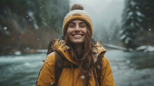 A Happy Young Woman In A Yellow Jacket And A Backpack Enjoys A Walk.