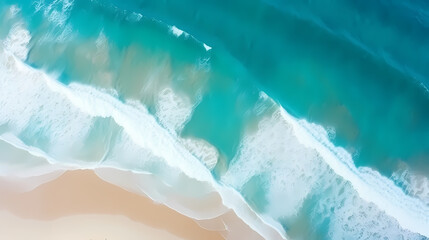 Canvas Print - Sandy beach with light blue transparent water waves and sunlight, tranquil aerial beach scene