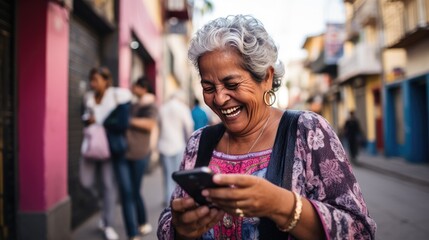 Wall Mural - Happy smiling senior woman is using a smartphone outdoors