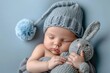 a peaceful baby, wrapped in tranquility, with eyes closed and a gentle smile, cradling a gray knitted bunny and adorned in a blue knitted cap with a playful pompom.