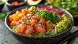 Close-up hawaiian salmon fish poke bowl with rice, radish, cucumber, edamame