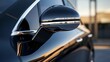 A closeup of the side mirror reveals a chrome accent trim around the base adding a touch of elegance to the cars exterior.