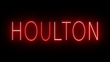 Flickering Red Retro Style Neon Sign Glowing Against A Black Background For HOULTON