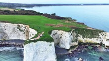 Aerial View Panning Right Along The Chalk White Cliffs At Old Harry Rocks England