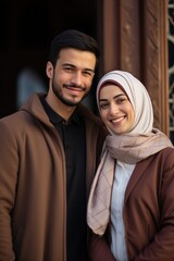 Wall Mural - A Muslim man and woman standing together, showcasing their love and faith.
