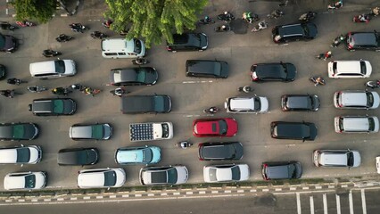 Wall Mural - Top down view cars and motorcycle moving on traffic jam at rush hour