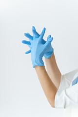 Wall Mural - The doctor or cosmetologist wears sterile gloves to work with the patient. Medicine, cosmetology concept