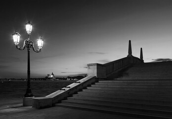 Idyllic landscape of street lamp, bridge and canal in Venice, Italy