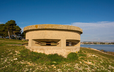 Wall Mural - A World War Two bunker on the coast of the Kasteja Forest Park - Park Suma Kasteja - in Medulin, Istria, Croatia. December