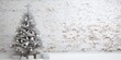 Christmas tree against white brick wall
