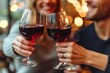 © Adobe Contributor - Couple toasting with red wine glasses in a restaurant