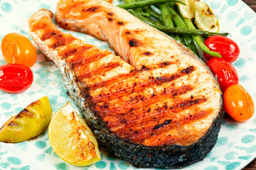 Wall Mural - Grilled trout steak on a plate.