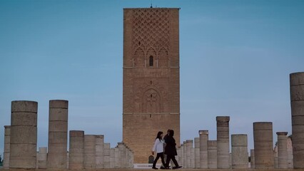 Wall Mural - Tourists are walking around the square of the Hassan Mosque in Rabat, Morocco