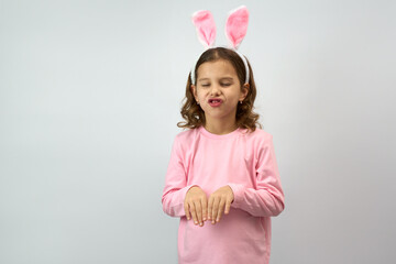 Cute little child wearing bunny ears on Easter day