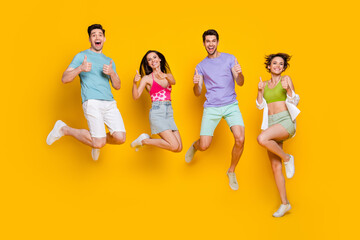 Canvas Print - Full length photo of excited people jump make fune symbol demonstrate good choice promo isolated shine color background