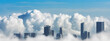 panorama long narrow skyline skyscrapers in the clouds.