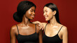 © Beauty Agent Studio - Multi Ethnic Group of beauty Womans with diffrent types of skin  together and looking on camera. Two Diverse ethnicity women -  African and Asian posing and smiling against red background.