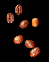 Wall Mural - Coffee beans isolated on black background. Close-up