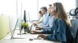 © opolja - Colleagues working in a call center.