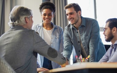 Canvas Print - Meeting, partnership and business people shaking hands in the office for a deal, collaboration or onboarding